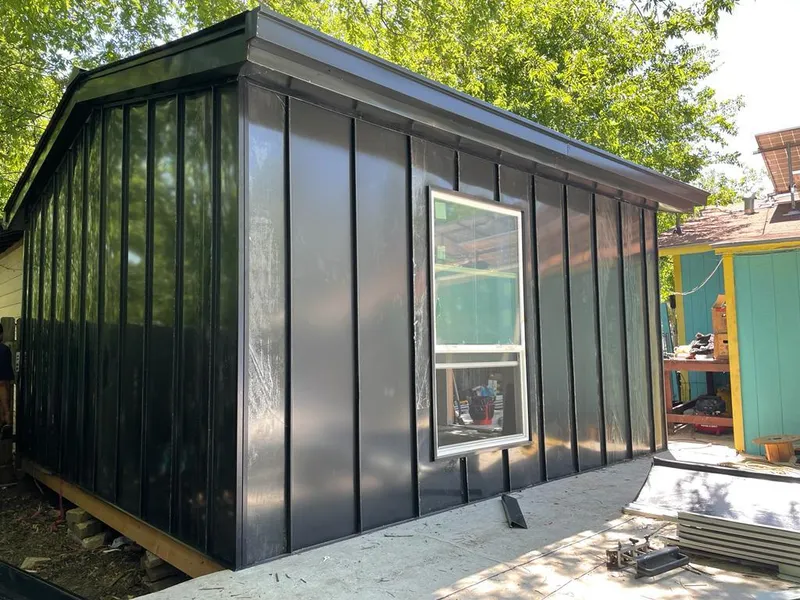 Black standing seam metal wall panels for Roof Inspection in De Queen